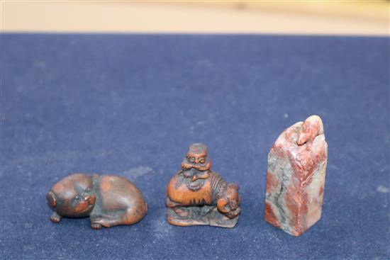 Two Japanese carved wood netsuke and a Chinese soapstone seal
